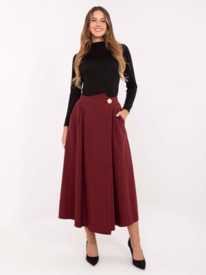 Klostuotas midi sijonas su dekoratyvine saga "MANNI" bordo